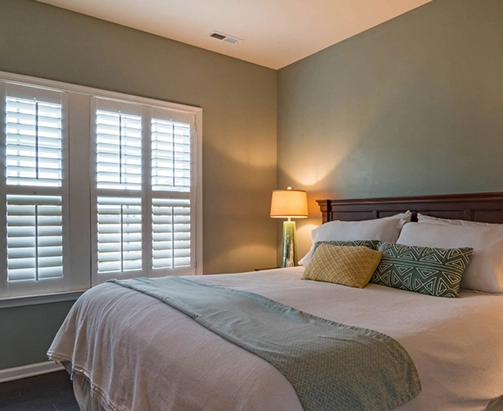 Cellular and pleated shades in Orr Lake bedroom