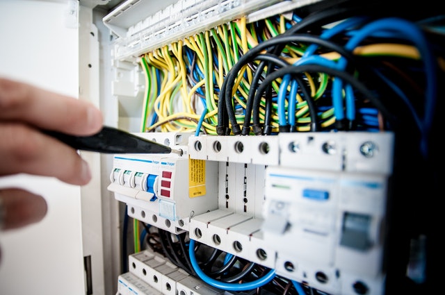 A person working on a circuit breaker.