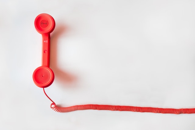 Red phone with white background.