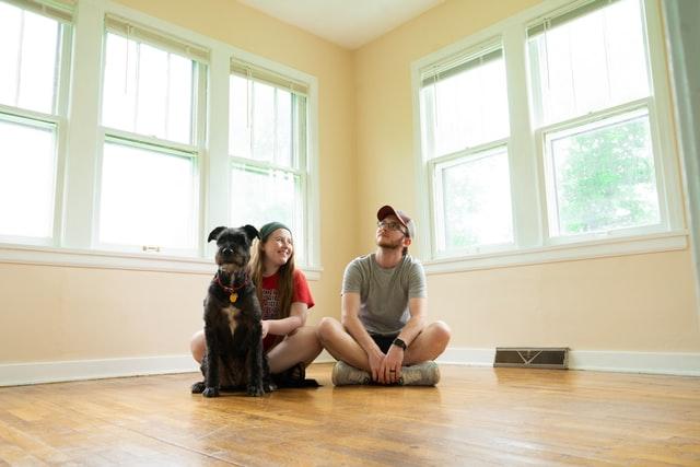 Man and woman in a house talking about the importance of home inspection when purchasing a new house