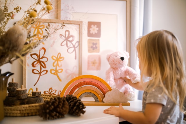 a  little girl playing in her room