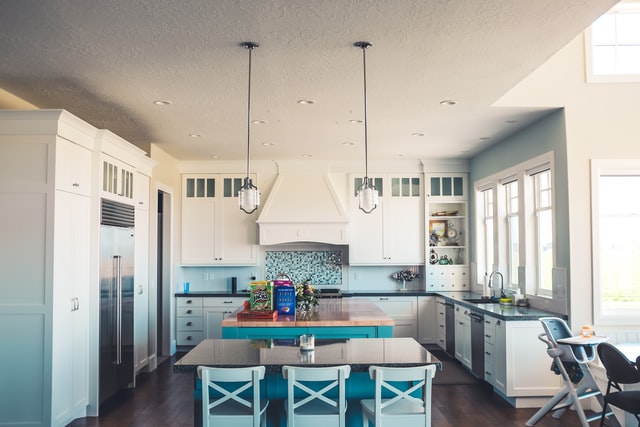 a clean and tidy kitchen with a dining area