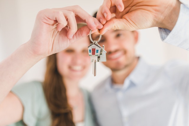 A couple holding the keys to their new home