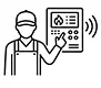 Technician performing fire alarm testing in Medicine Hat