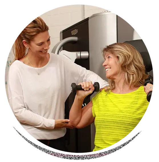 woman receiving assessment from pre/postnatal certified coach