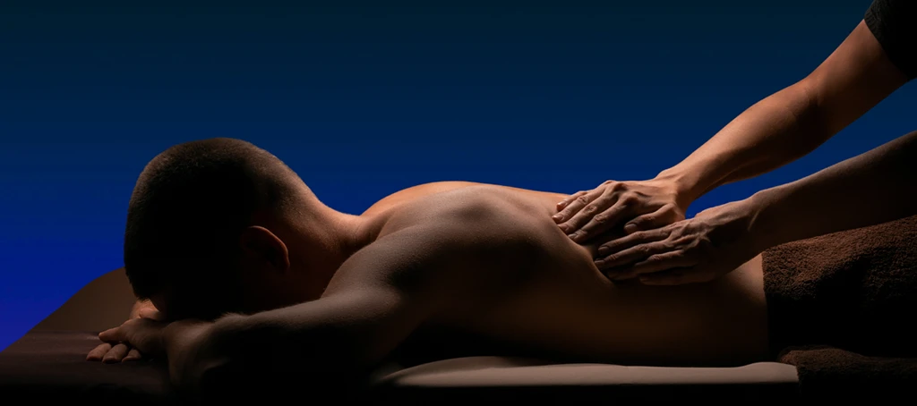 Elite Healers client receiving treatment from a sports massage therapist in NYC