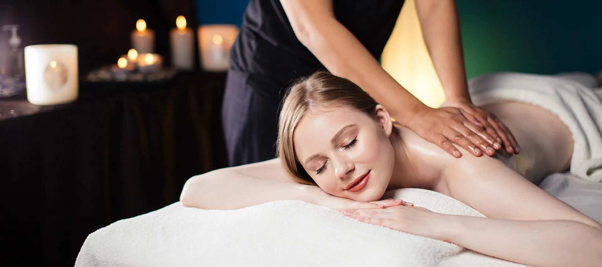 Sports massage FAQ page for Elite Healers in Midtown Manhattan NYC answering questions about deep tissue, medical, and recovery massage