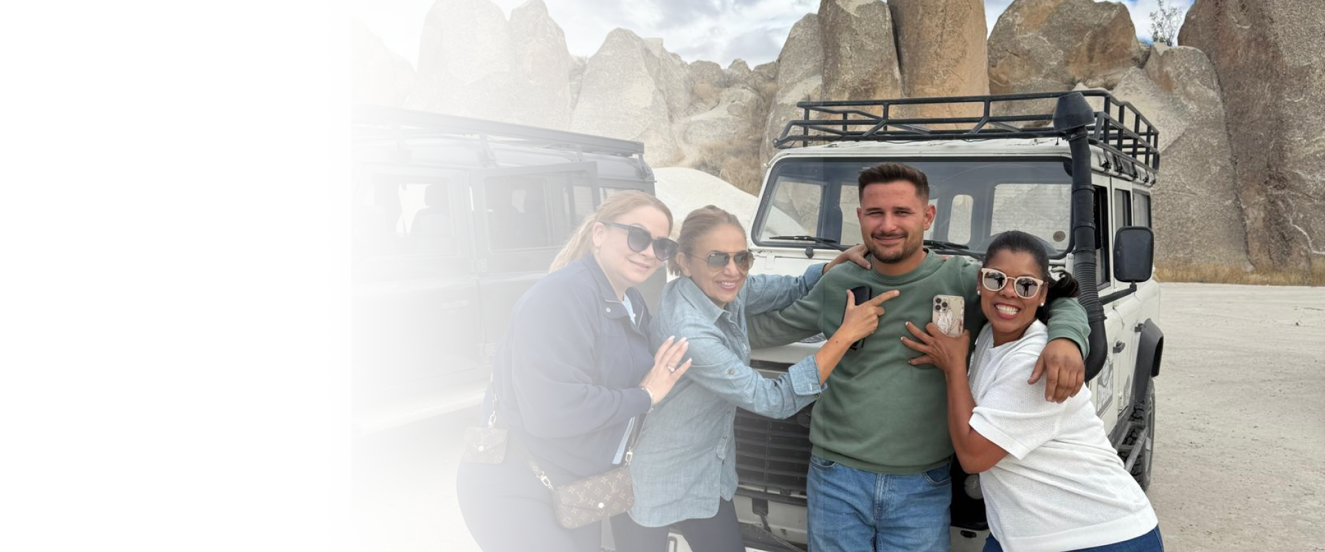 A smiling group of travelers enjoying a sunset city tour planned by a travel agency in Lodi.