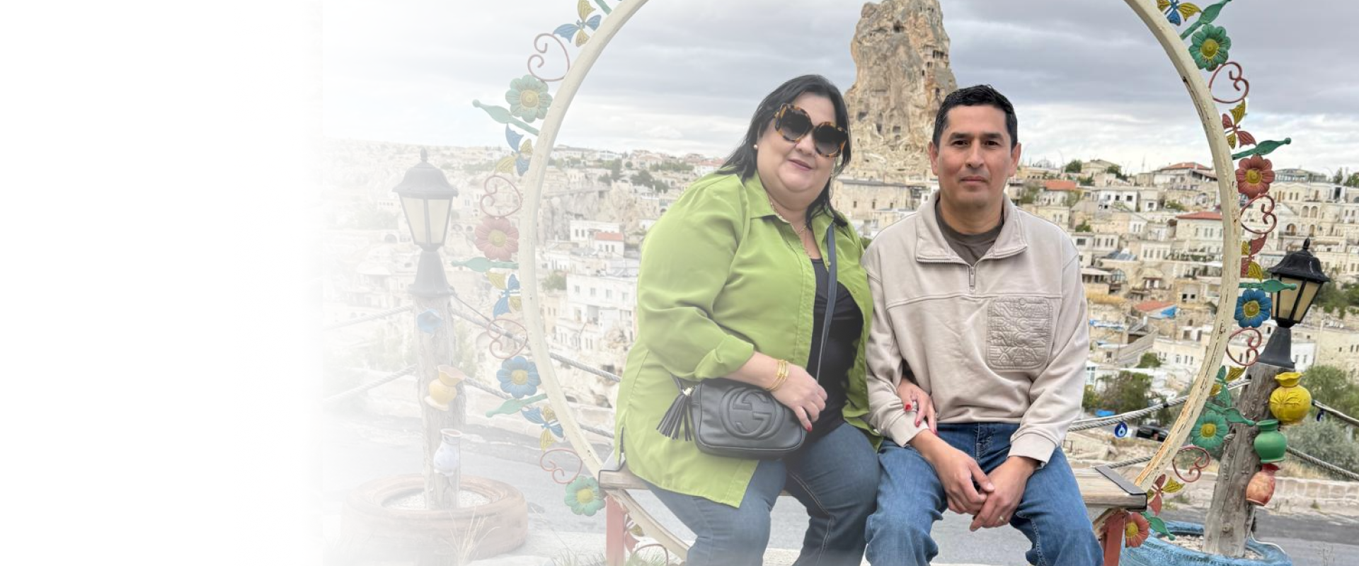 A smiling group of travelers enjoying a sunset city tour planned by a travel agency in Lodi.